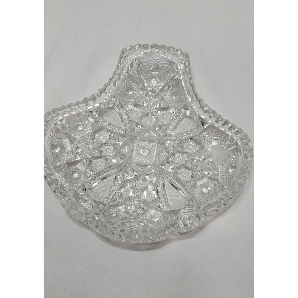 This Clear Glossy Pressed Glass Candy Dish features an abstract shape,